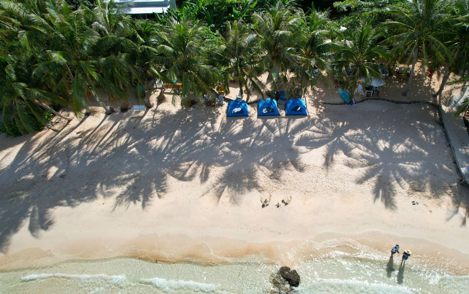 Camping on the stunning beach of May Rut Trong Island and look at the sea.