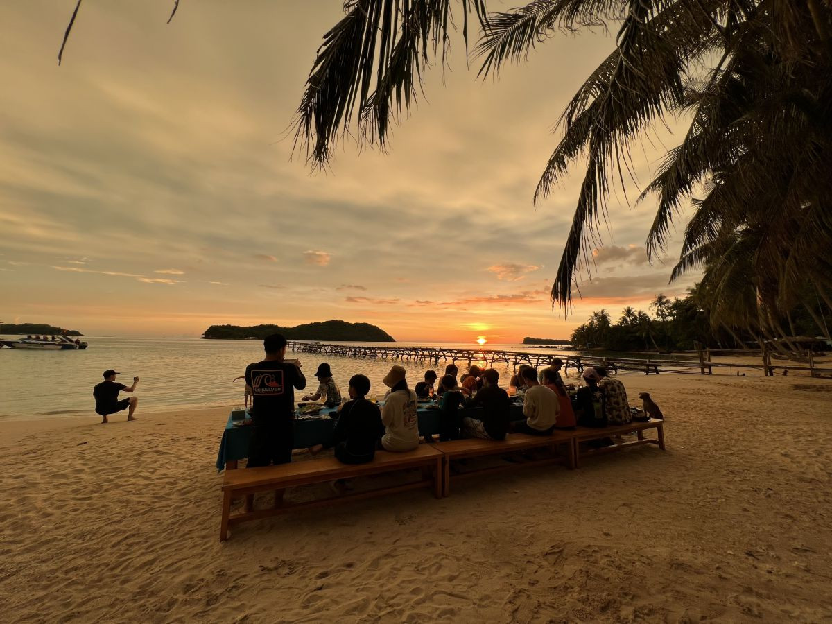 Enjoy BBQ dinner on the beach at dusk