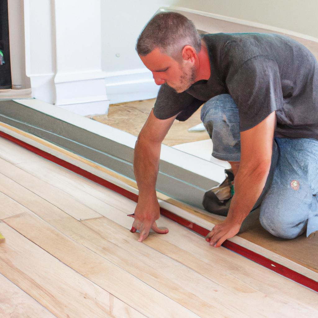 Thợ thủ công tài ba từ Ferino Wood lắp đặt sàn gỗ Thermo Ash với sự chính xác và kỹ thuật cao.